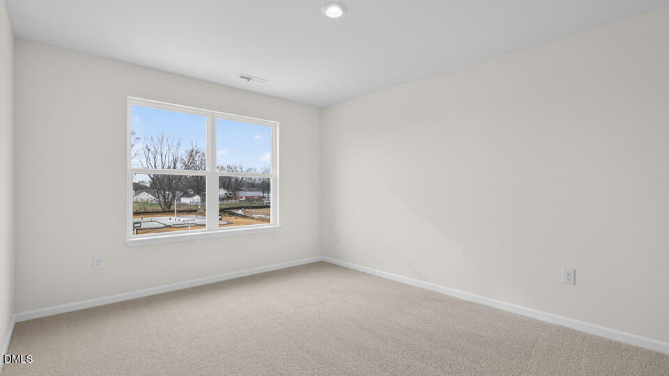 45 Red Clover Drive Angier, NC 27501 - Photo 14 of 34 a view of an empty room with a window