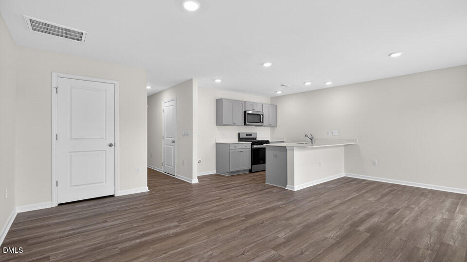 45 Red Clover Drive Angier, NC 27501 - Photo 3 of 34 a view of kitchen with wooden floor