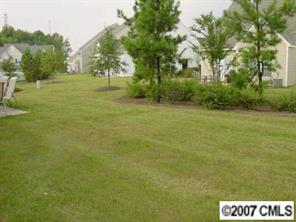 11612 Rabbit Ridge Road, Unit 11612 Charlotte, NC 28270 - Photo 3 of 8 a view of grassy field with trees