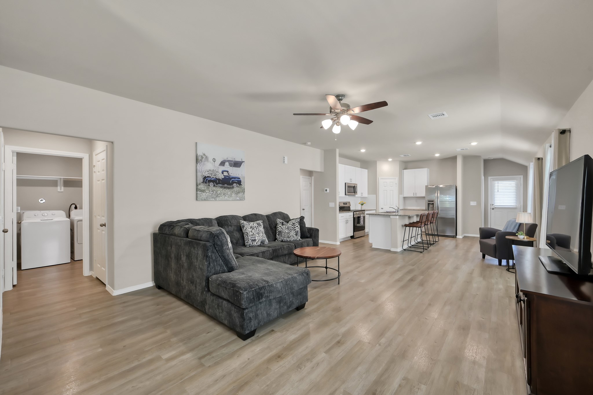 514 Dalloway Street Conroe, TX 77316 - Photo 7 of 27 Bright and spacious living area with seamless flow to kitchen and dining