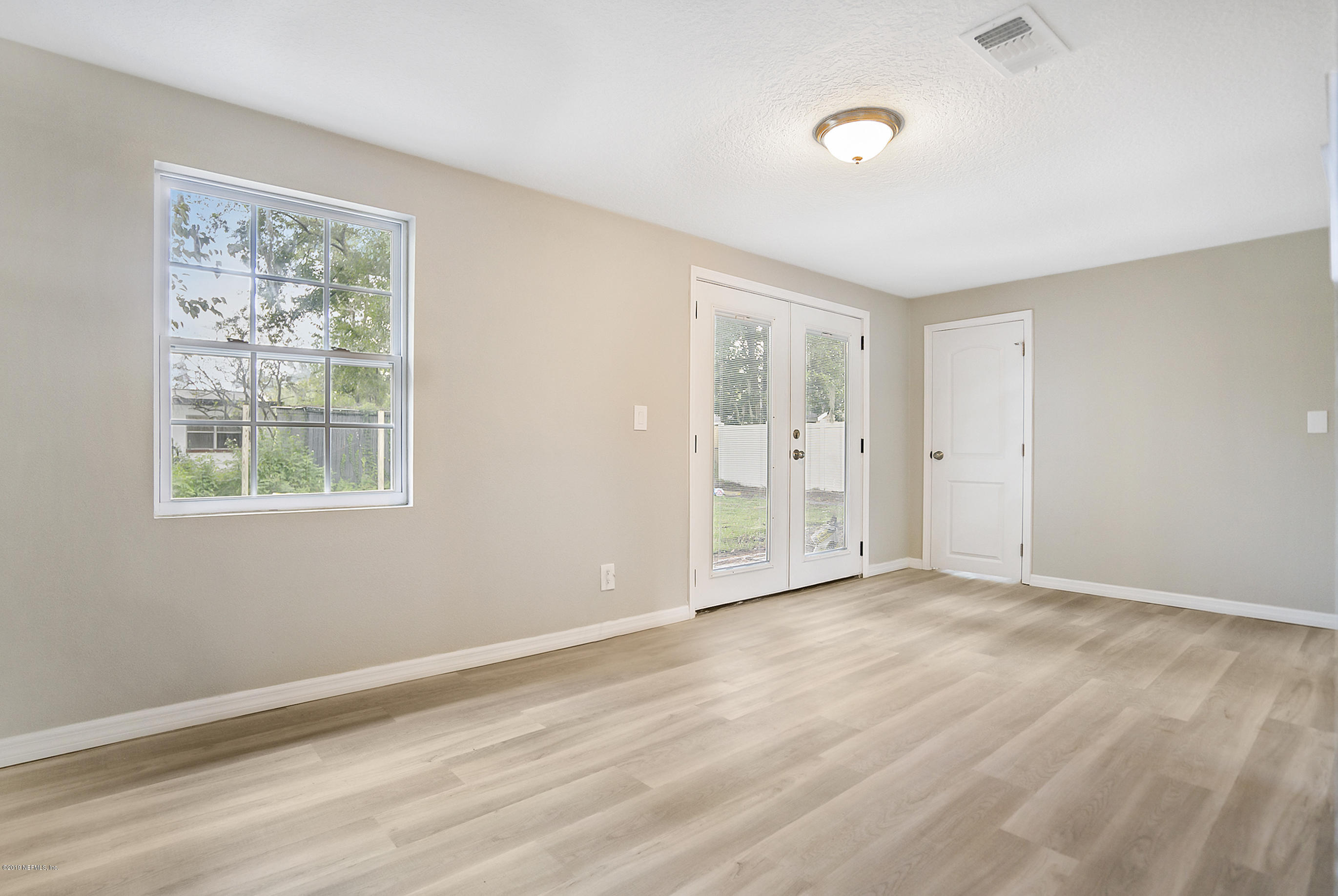 10483 Tulsa Road Jacksonville, FL 32218 - Photo 17 of 30 a view of an empty room with a window