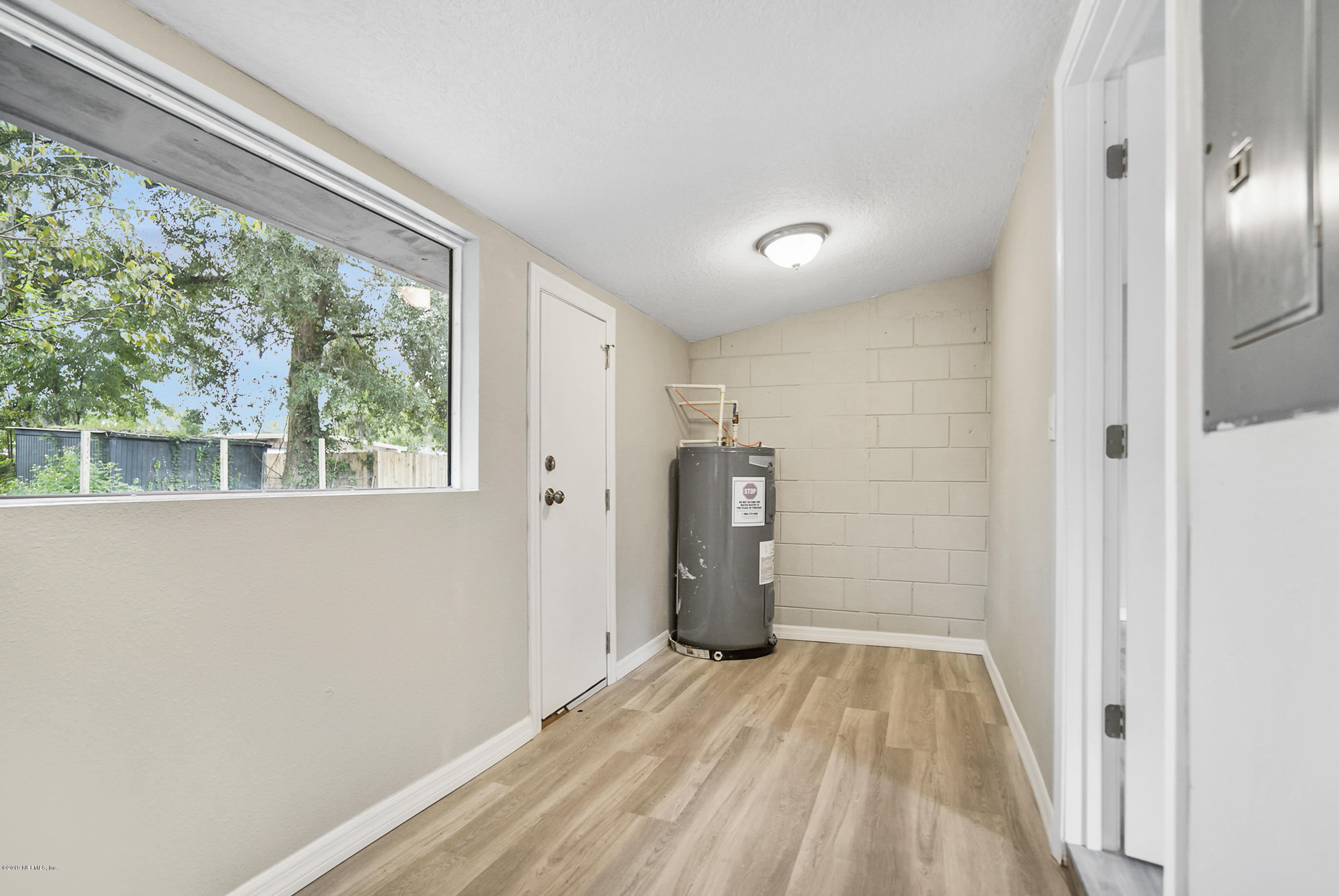 10483 Tulsa Road Jacksonville, FL 32218 - Photo 23 of 30 a view of empty room with a window and refrigerator