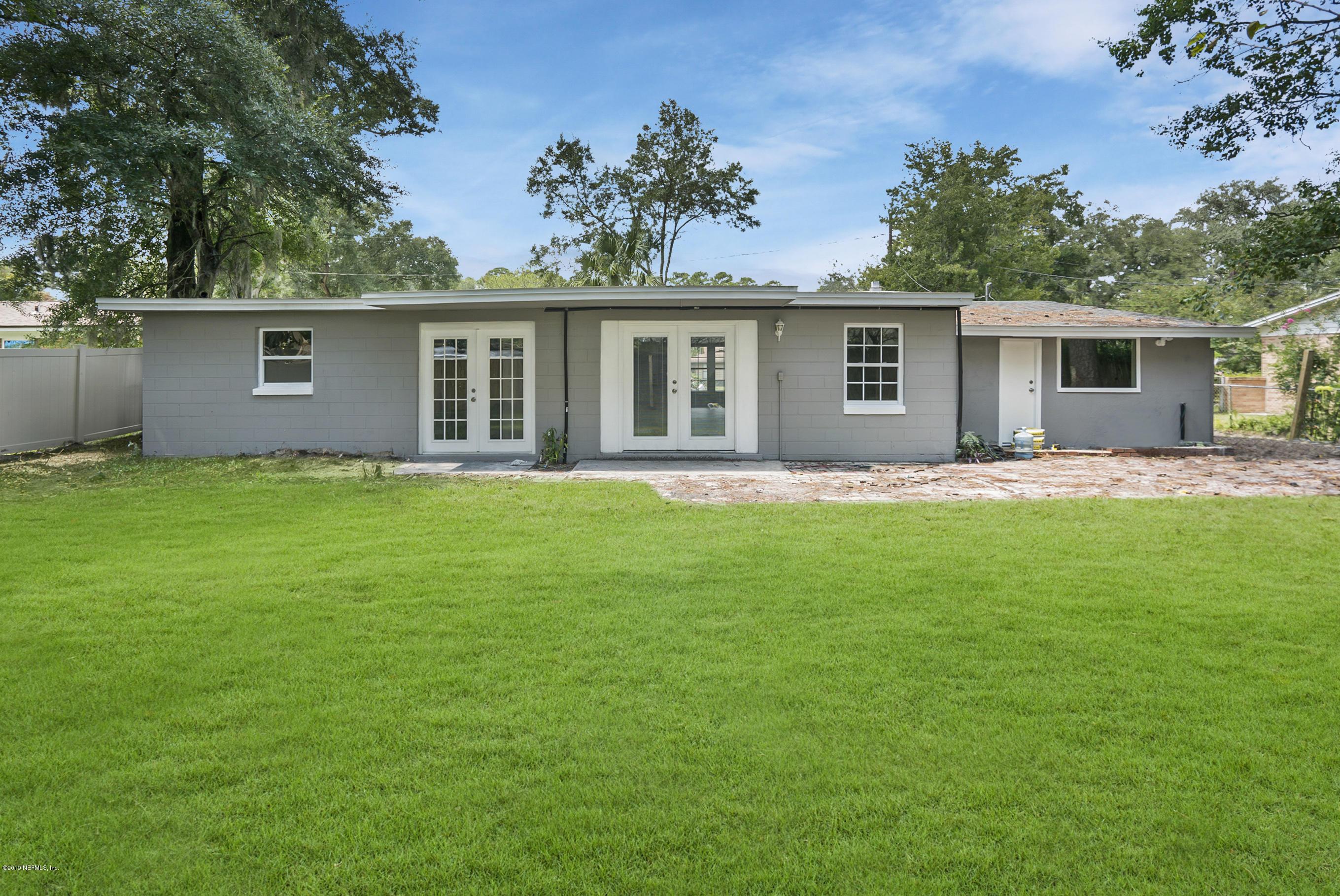 10483 Tulsa Road Jacksonville, FL 32218 - Photo 29 of 30 a house view with a sitting space and garden