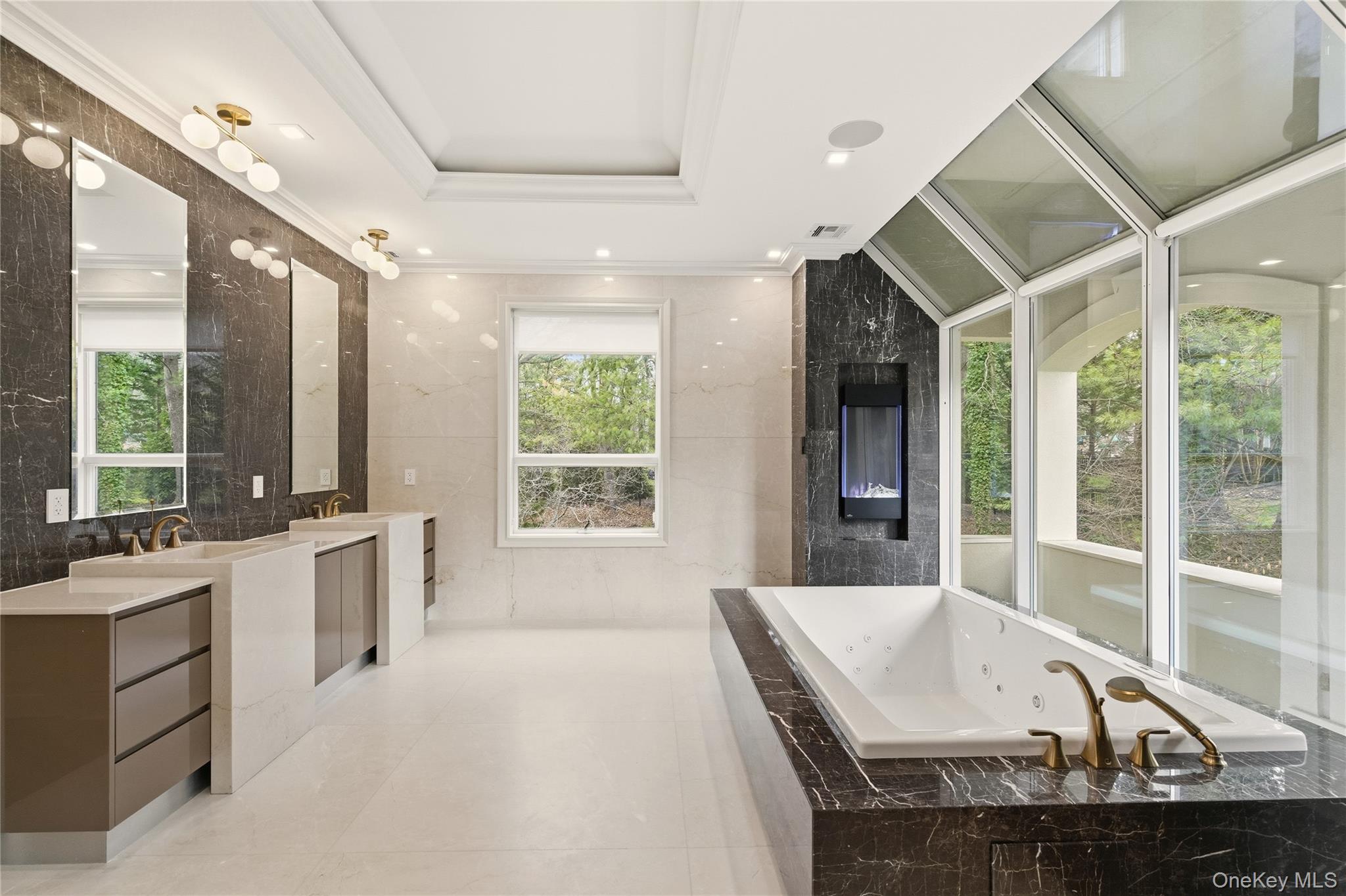 55 Coves Run Syosset, NY 11791 - Photo 27 of 50 a large white kitchen with a large window