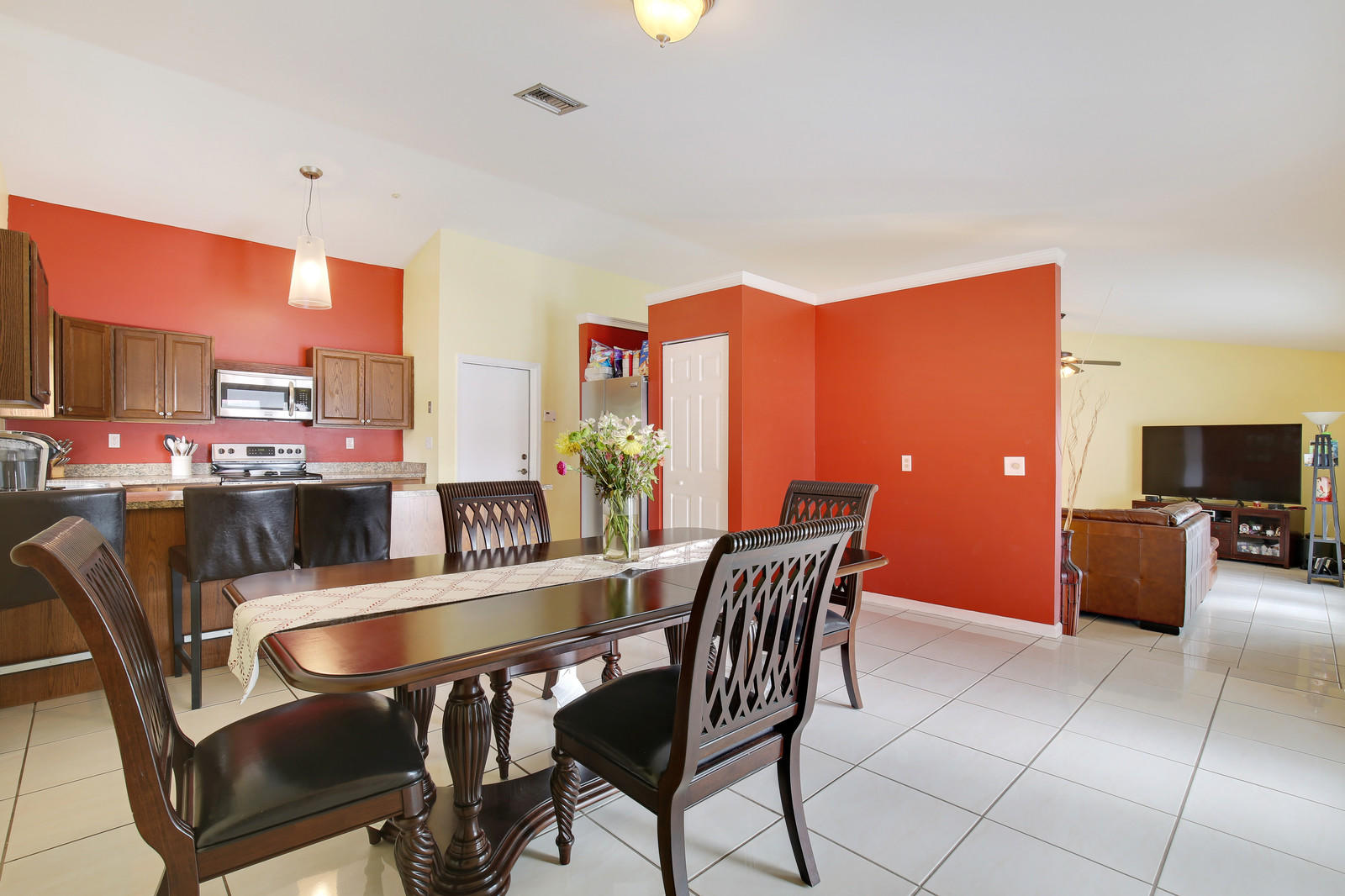 2144 Park Place Boca Raton, FL 33486 - Photo 7 of 20 a dining room with furniture and a flat screen tv