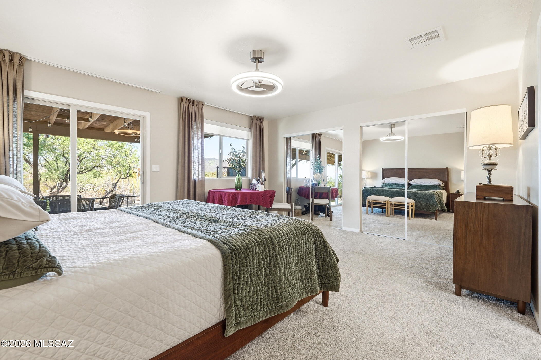 13599 East Rincon Ranch Road Vail, AZ 85641 - Photo 24 of 41 a spacious bedroom with a large bed and a large window