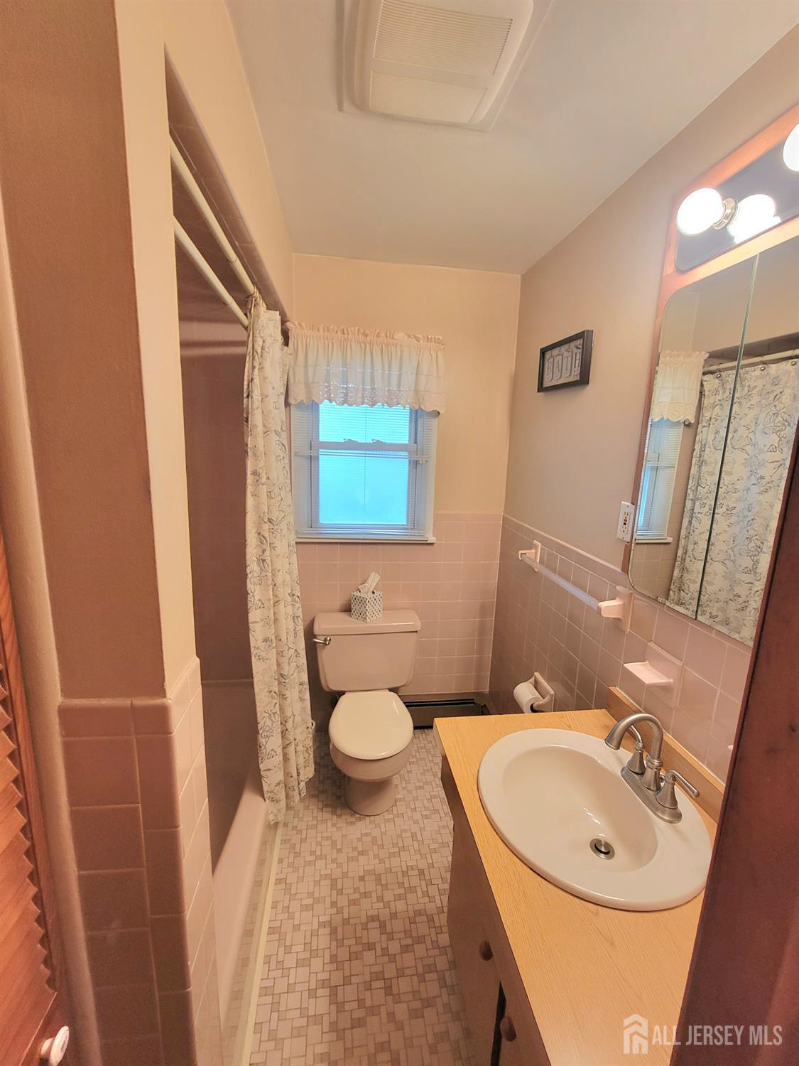 937 North Concourse Keyport, NJ 07735 - Photo 15 of 27 a bathroom with a sink a toilet and a mirror