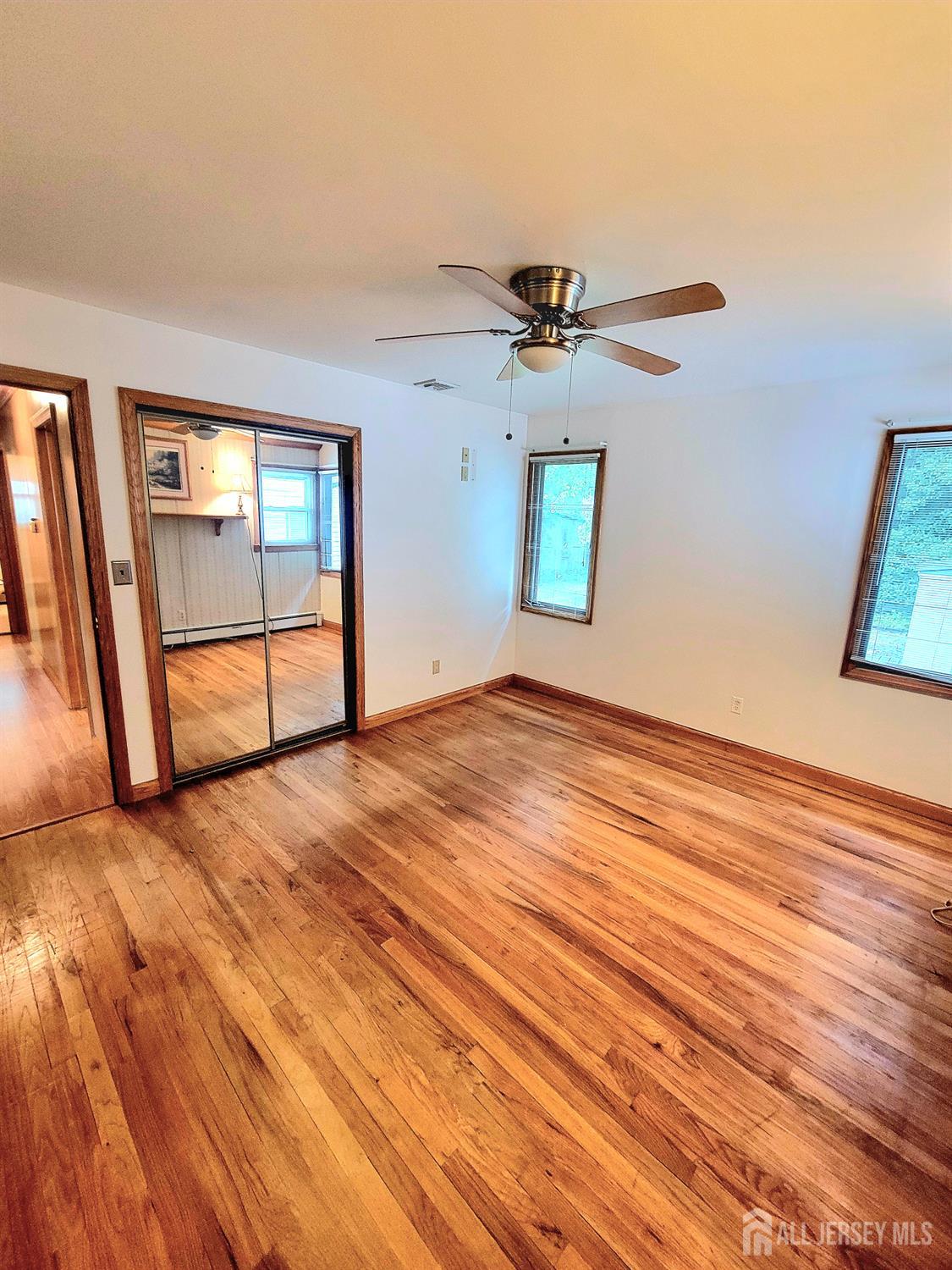 937 North Concourse Keyport, NJ 07735 - Photo 16 of 27 a view of empty room with wooden floor and fan