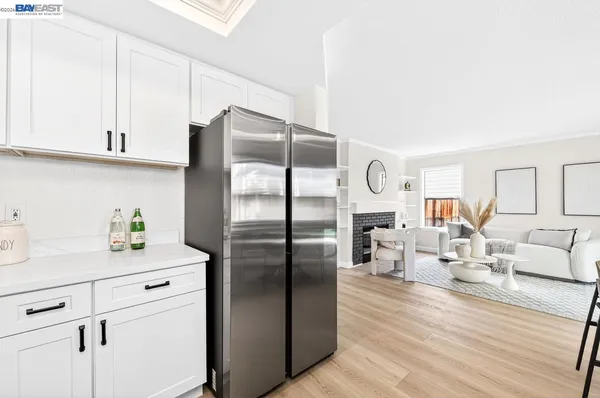 a kitchen with cabinets and stainless steel appliances