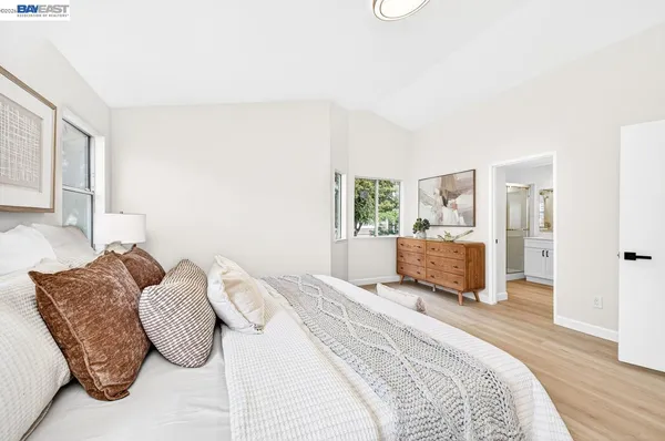 a bedroom with a bed and a couch