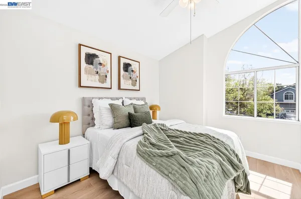 a bedroom with bed and a window