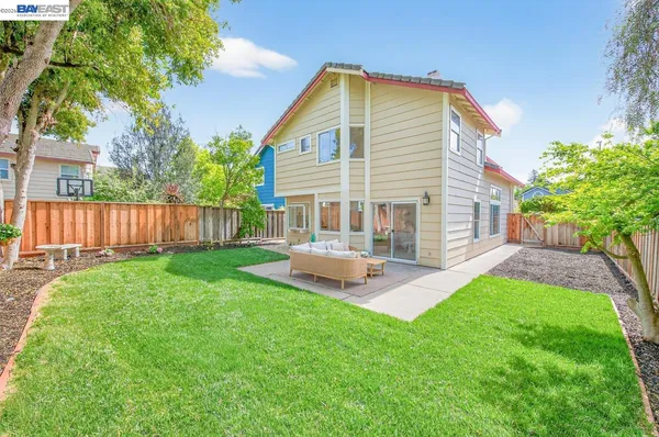 a front view of a house with a yard and porch