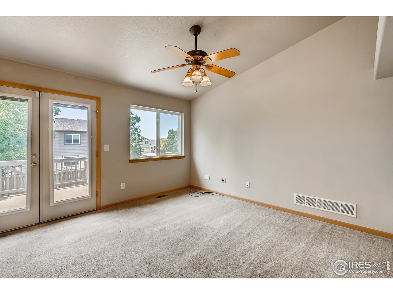 223 Aspen Grove Way Severance, CO 80550 - Photo 12 of 31 a view of an empty room with a window