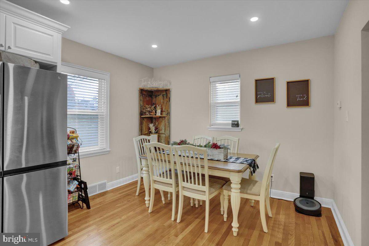 321 Jefferson Boulevard Reading, PA 19609 - Photo 12 of 32 a view of a dining room with furniture a rug and wooden floor