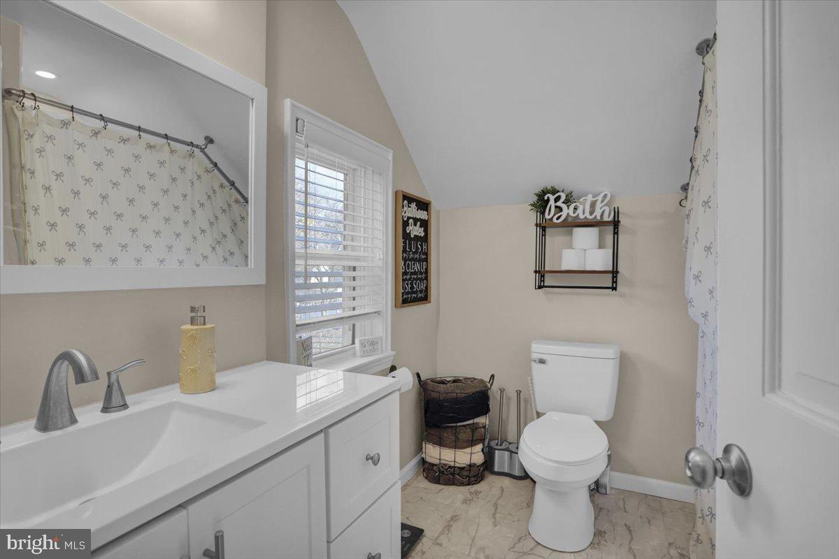 321 Jefferson Boulevard Reading, PA 19609 - Photo 15 of 32 a bathroom with a toilet sink and mirror