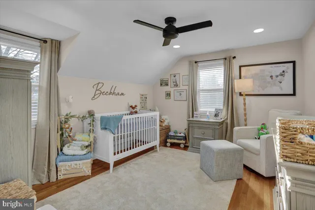 a bathroom with a toilet a sink and a mirror