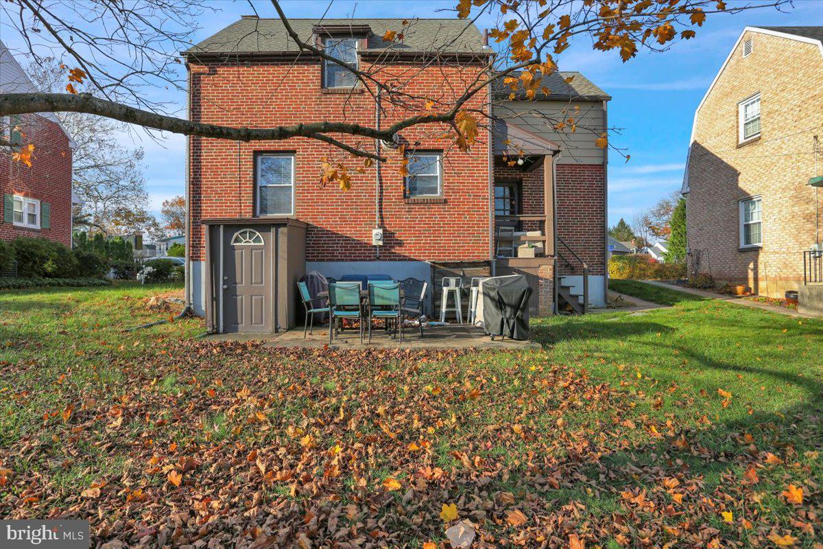 321 Jefferson Boulevard Reading, PA 19609 - Photo 28 of 32 a front view of a house with a yard and garage