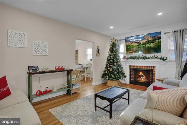 a living room with furniture fireplace and flat screen tv