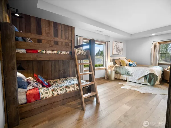 a bedroom with furniture and a gym equipment