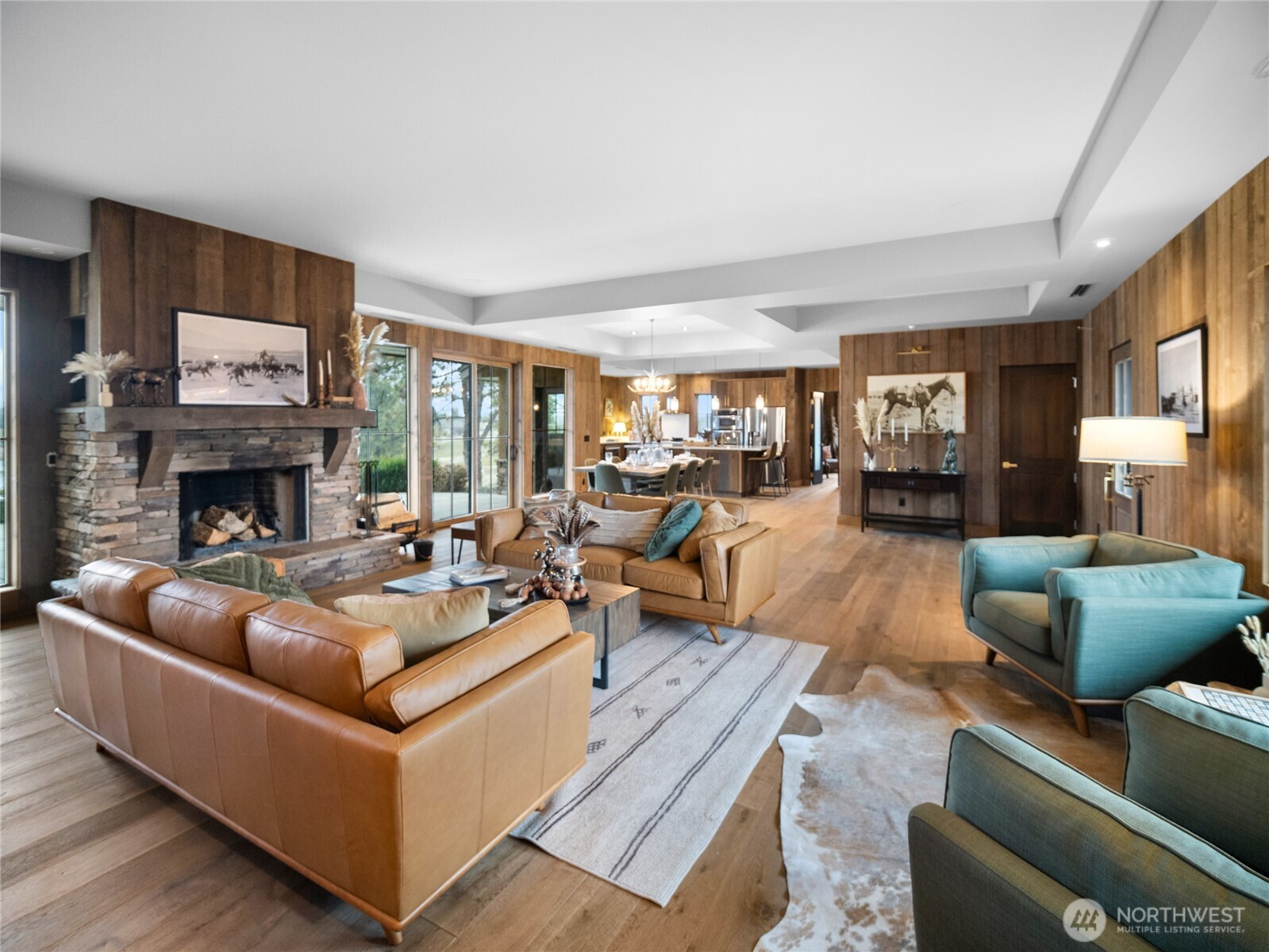 37227 South Long Road Cheney, WA 99004 - Photo 4 of 39 a living room with furniture a fireplace and a flat screen tv