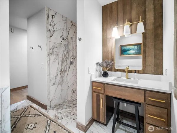 a bathroom with a sink and a mirror