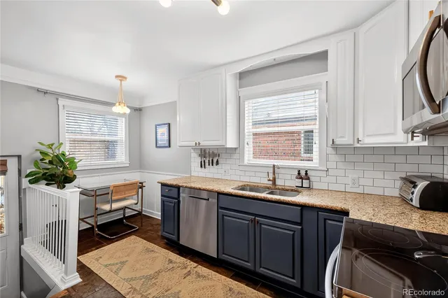 a kitchen with a sink cabinets and window
