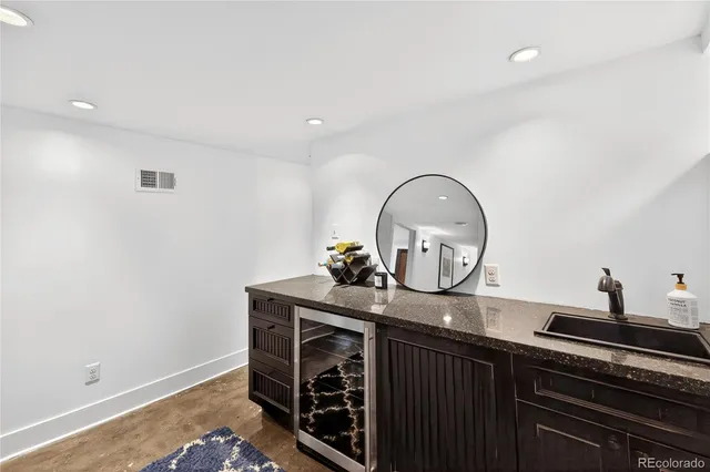 a view of a sink and a stove in a kitchen