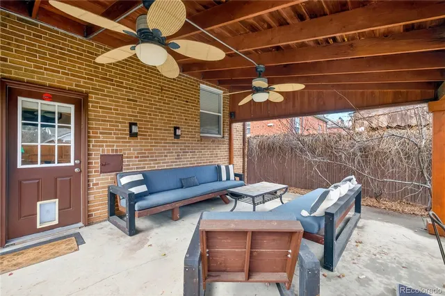 a outdoor living space with furniture and a fireplace