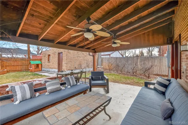 a view of a living room and a wooden deck