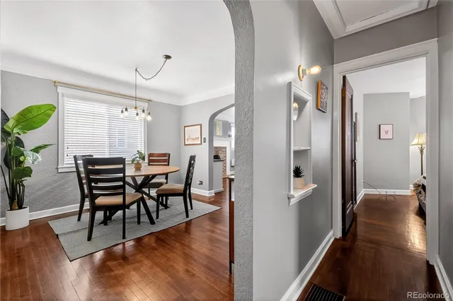a view of a dining room with furniture window and wooden floor