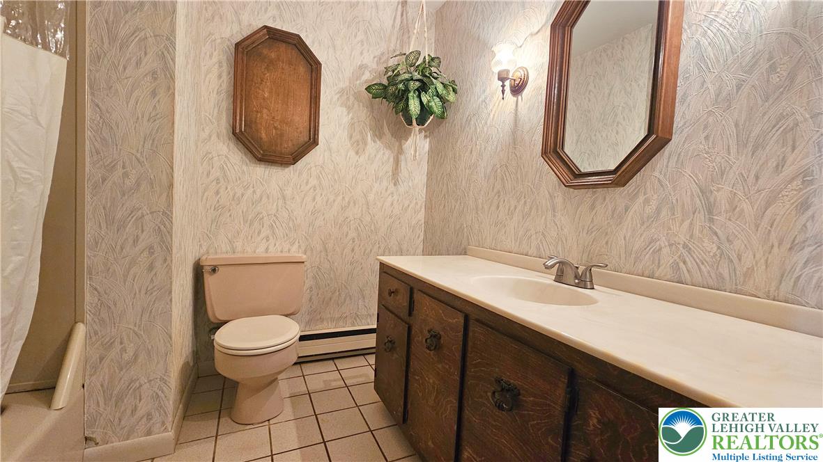 2810 County Line Road Riegelsville, PA 18077 - Photo 4 of 7 A well-maintained full bathroom featuring a vanity with ample storage and tiled flooring.