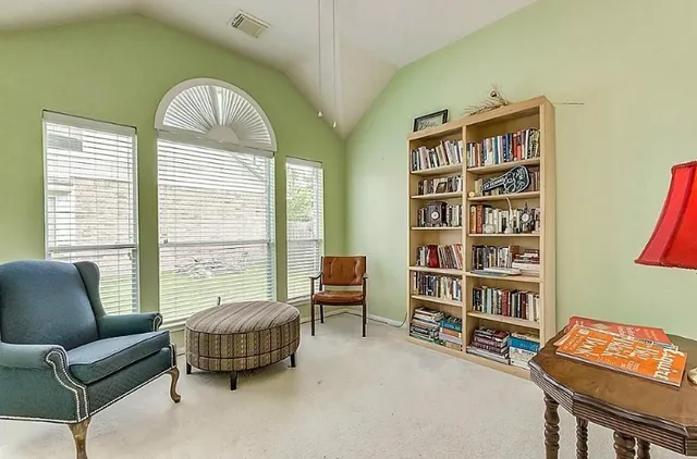 a living room with furniture and a window