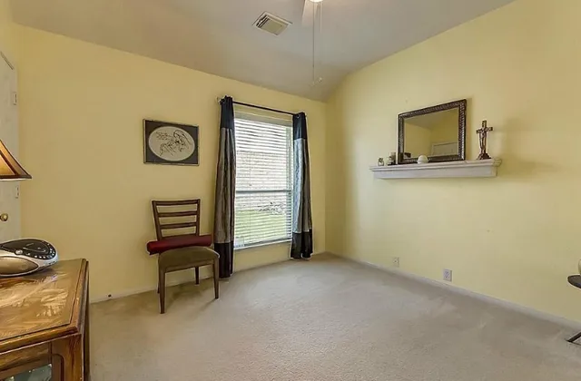 a view of room with window and wall painting