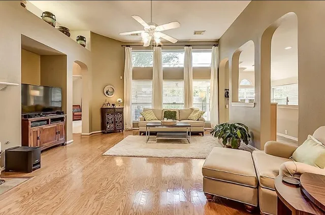 a living room with furniture and a flat screen tv