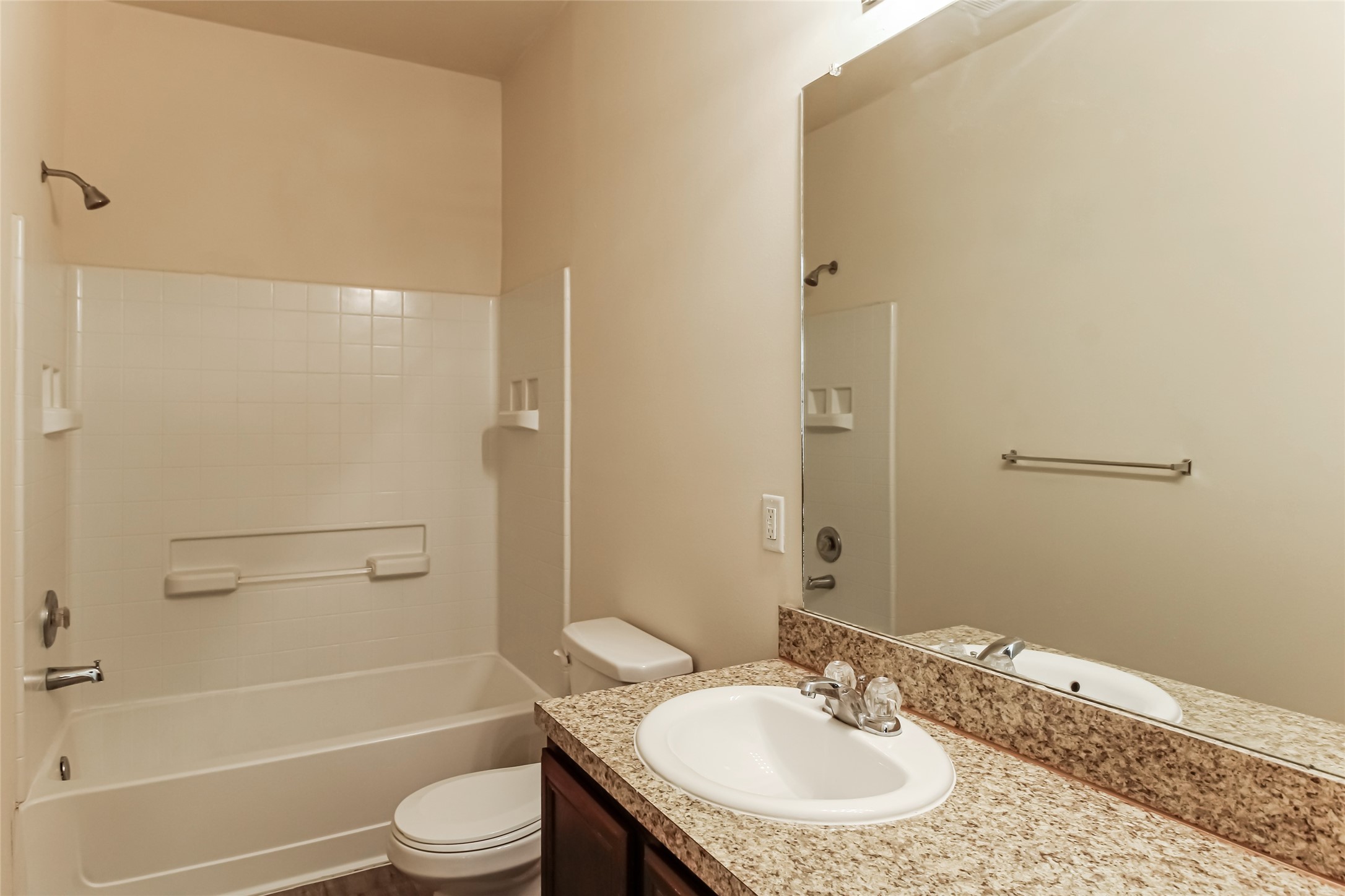 12406 Roy Mix Bohn Lane Houston, TX 77044 - Photo 12 of 16 a bathroom with a granite countertop sink toilet and shower