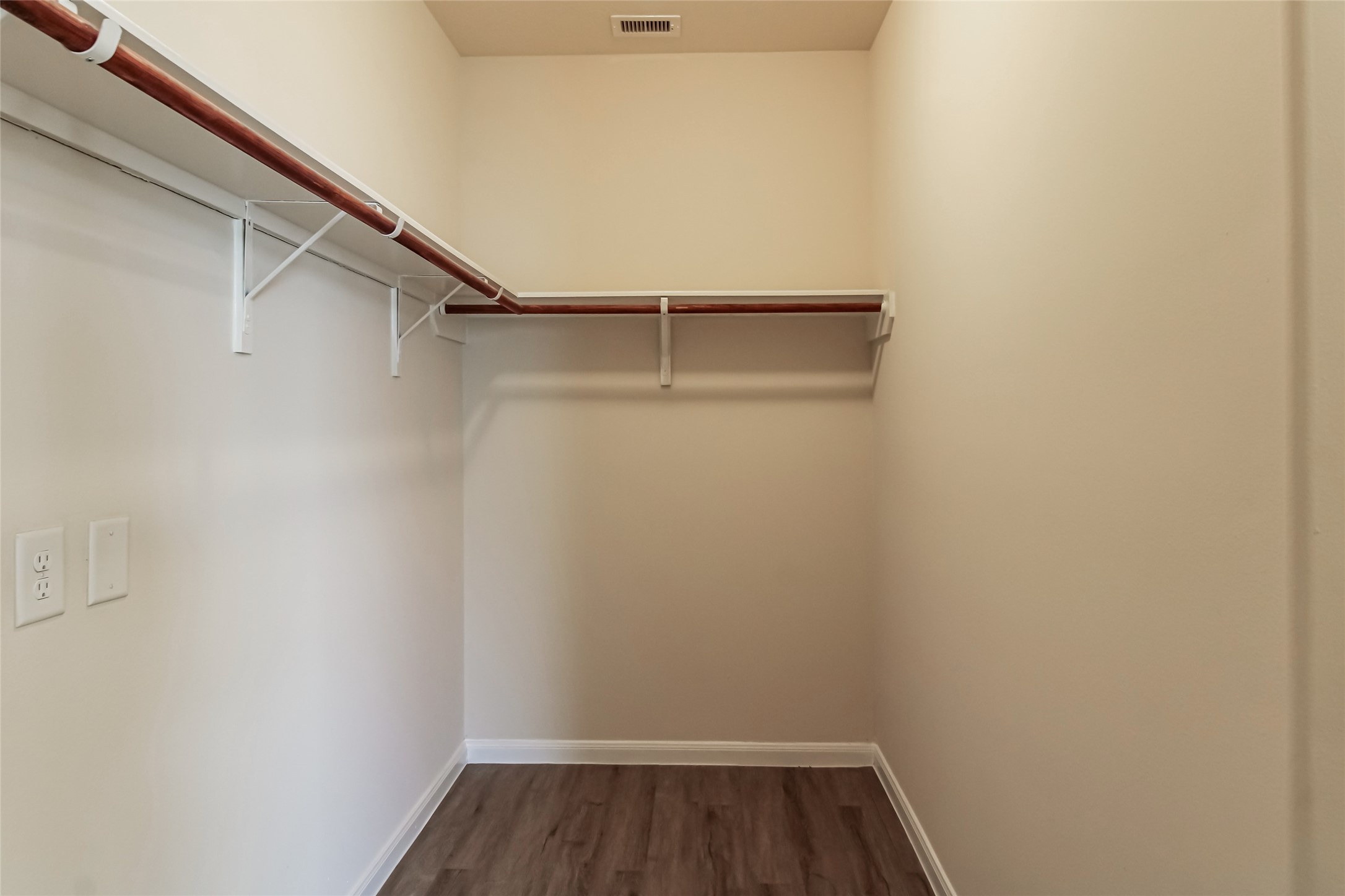 12406 Roy Mix Bohn Lane Houston, TX 77044 - Photo 13 of 16 a view of walk in closet with empty racks