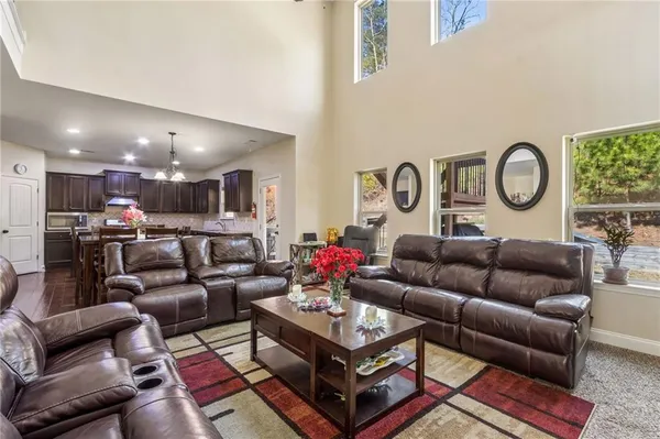 a living room with furniture and a clock