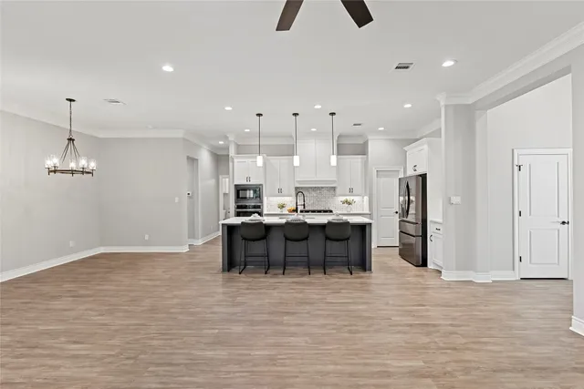 a view of a kitchen and dining room