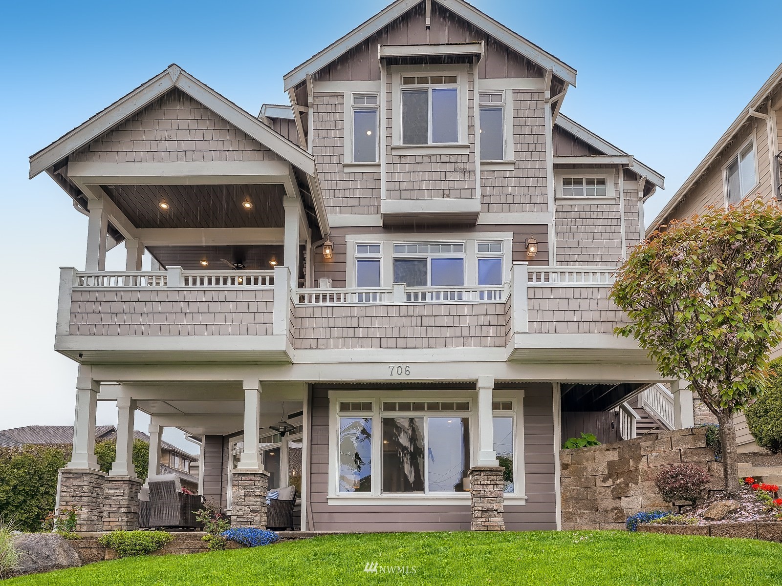 a front view of a house with garden