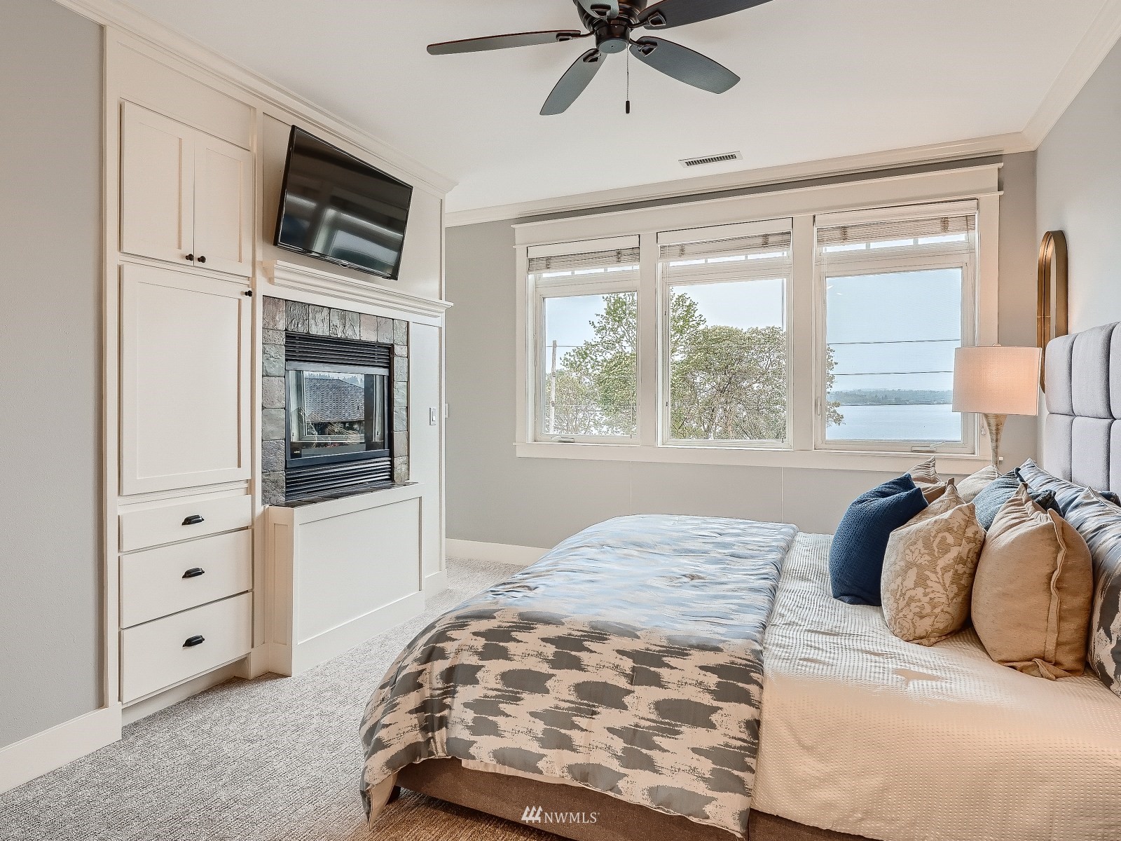 706 North 29th Street Renton, WA 98056 - Photo 17 of 37 a bedroom with a bed and a television