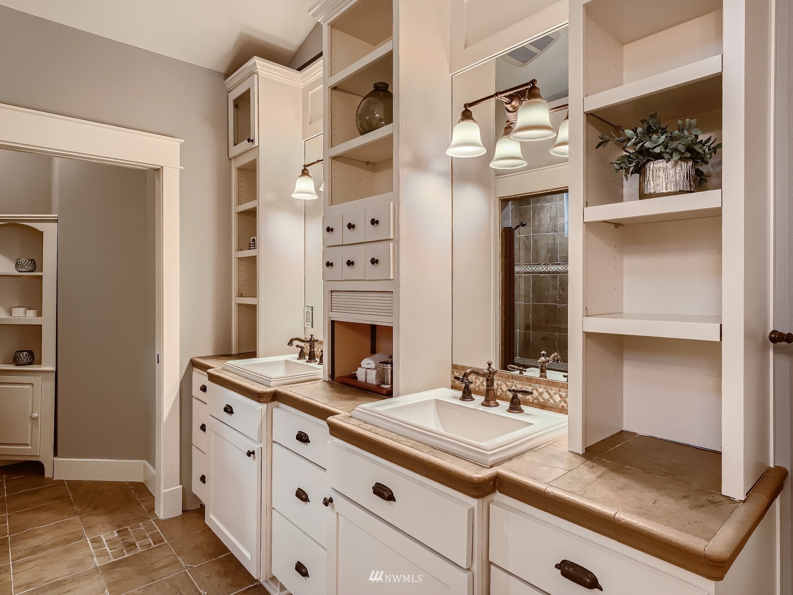 706 North 29th Street Renton, WA 98056 - Photo 19 of 37 a bathroom with a sink double vanity and a mirror