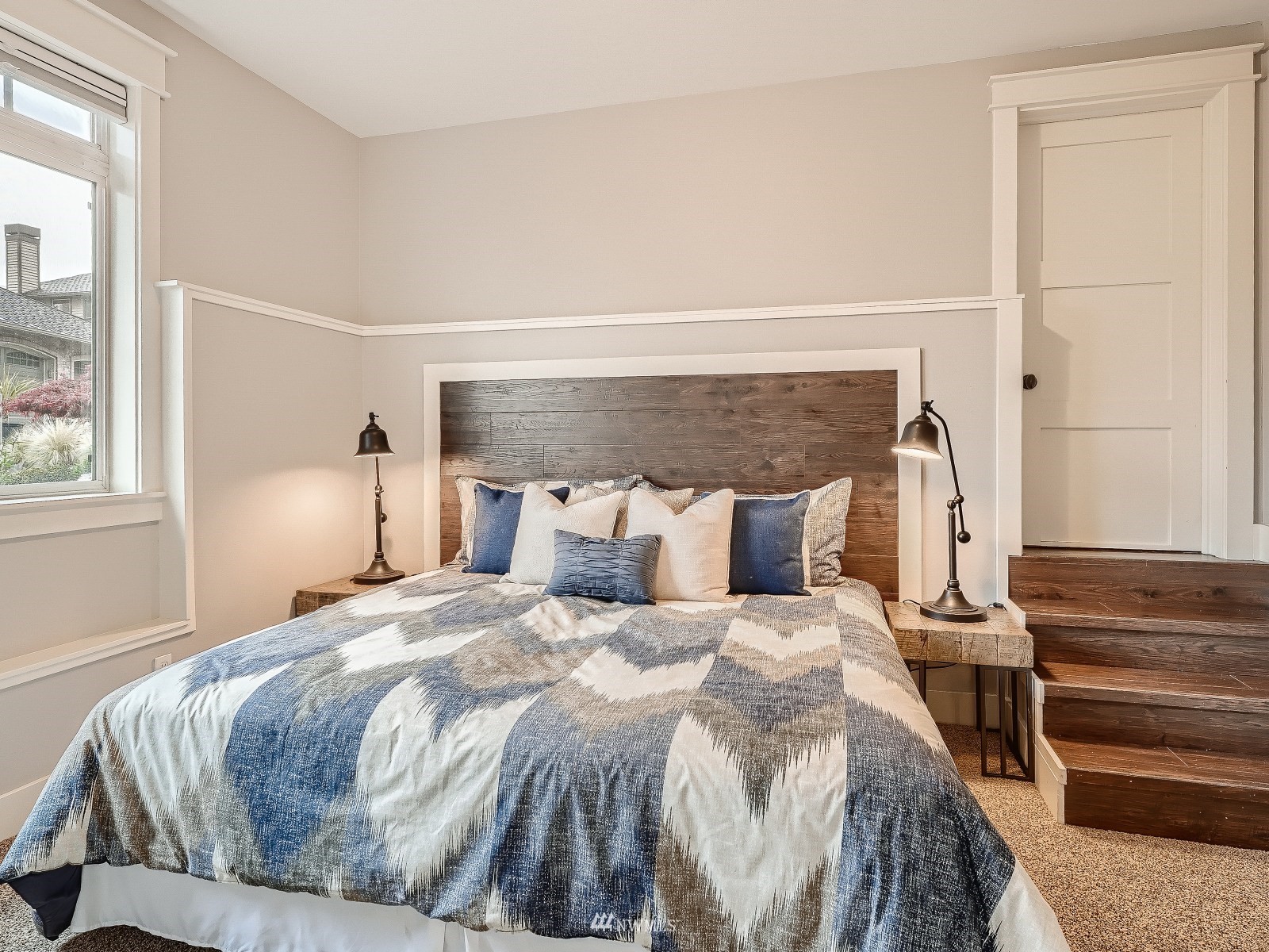 706 North 29th Street Renton, WA 98056 - Photo 31 of 37 a bedroom with a bed and wooden floor