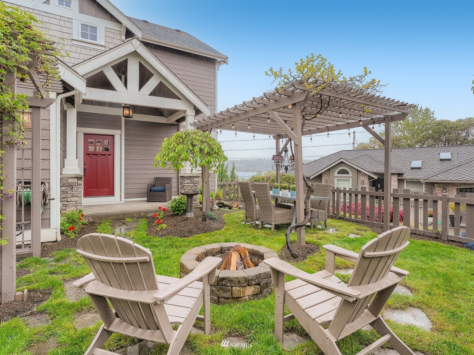 706 North 29th Street Renton, WA 98056 - Photo 36 of 37 a view of a house with backyard porch and sitting area