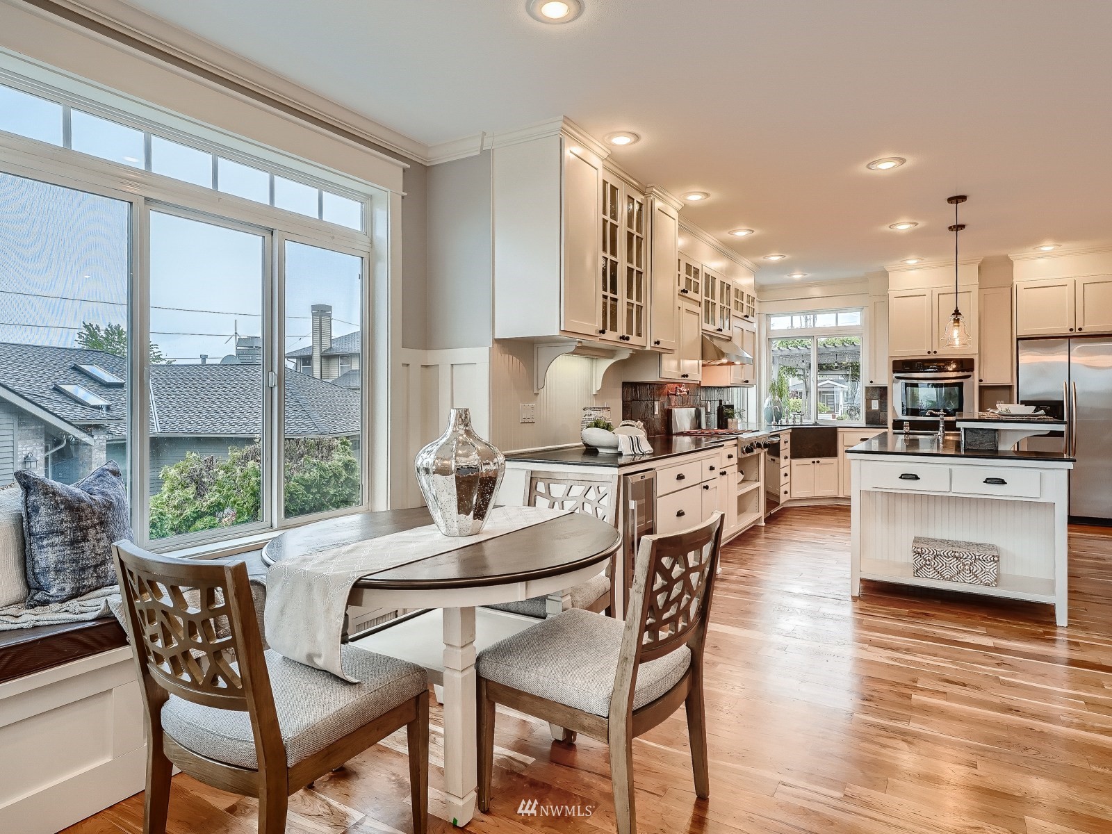 706 North 29th Street Renton, WA 98056 - Photo 8 of 37 a dining room with furniture and a floor to ceiling window