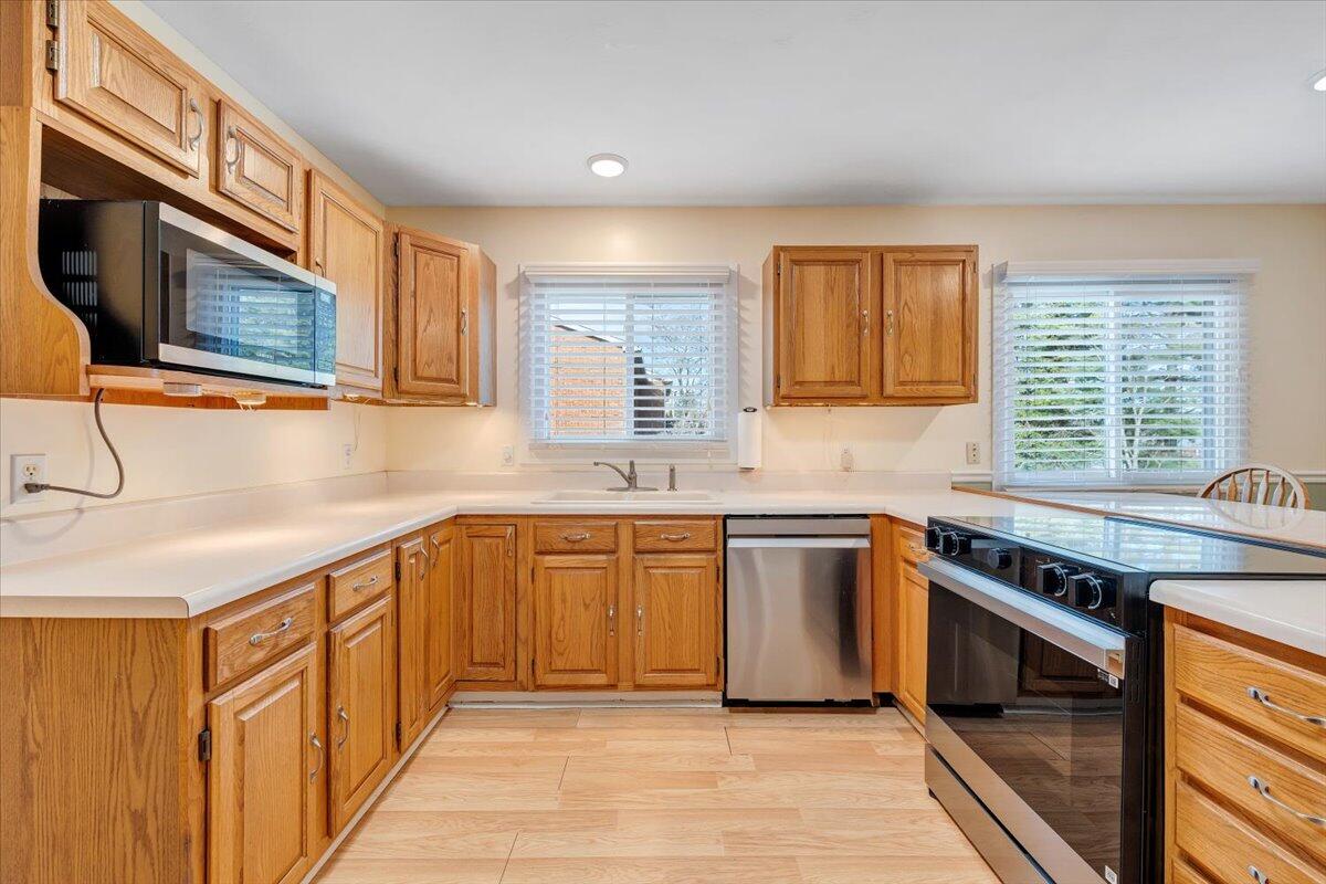 465 Summit Ridge Road Southwest Christiansburg, VA 24073 - Photo 18 of 79 a kitchen with stainless steel appliances granite countertop a stove and a sink