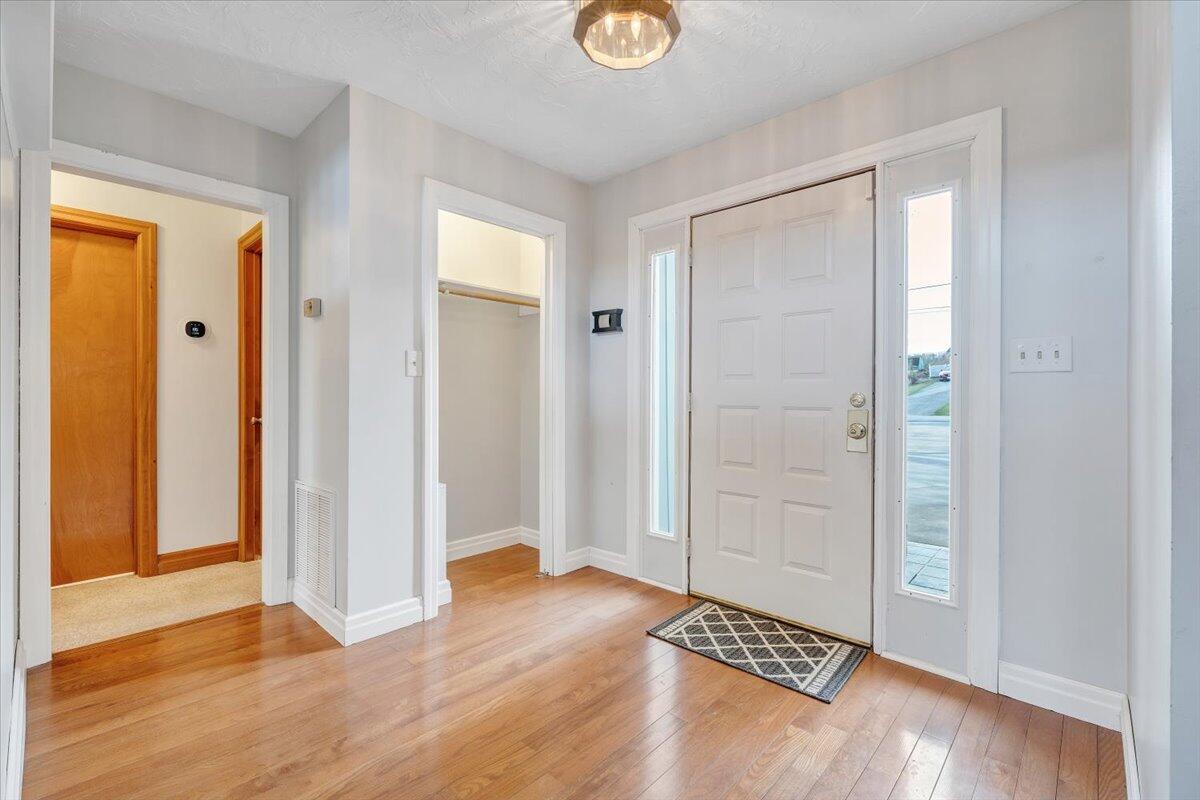 465 Summit Ridge Road Southwest Christiansburg, VA 24073 - Photo 3 of 79 wooden floor in an empty room with a window