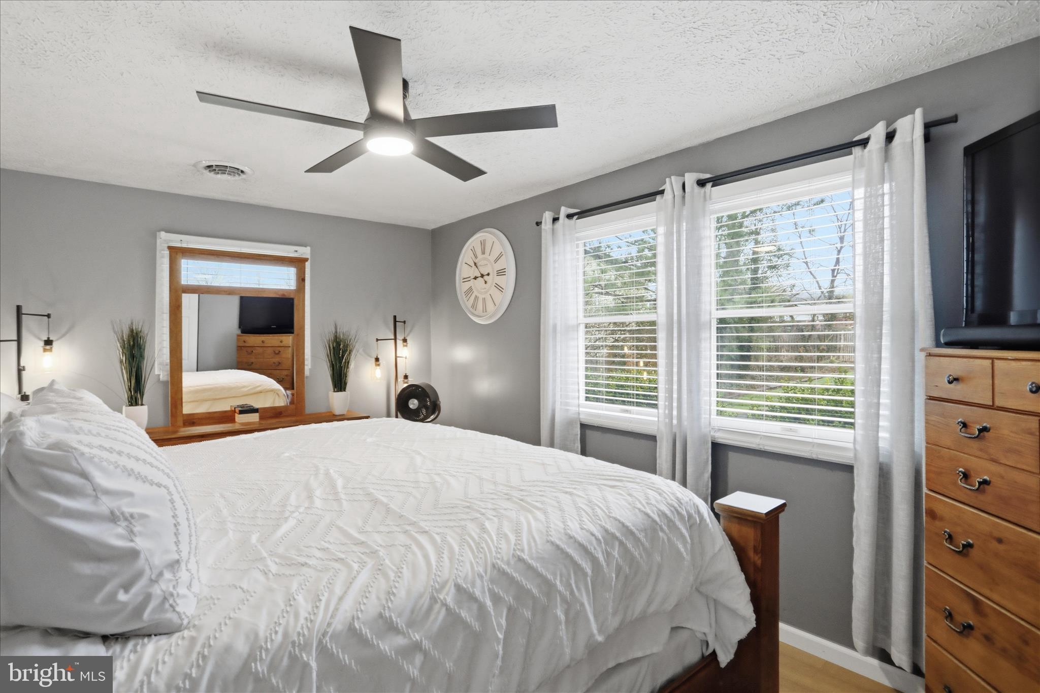 65 South Hummingbird Street Keyser, WV 26726 - Photo 21 of 30 a bedroom with a large bed and a large window