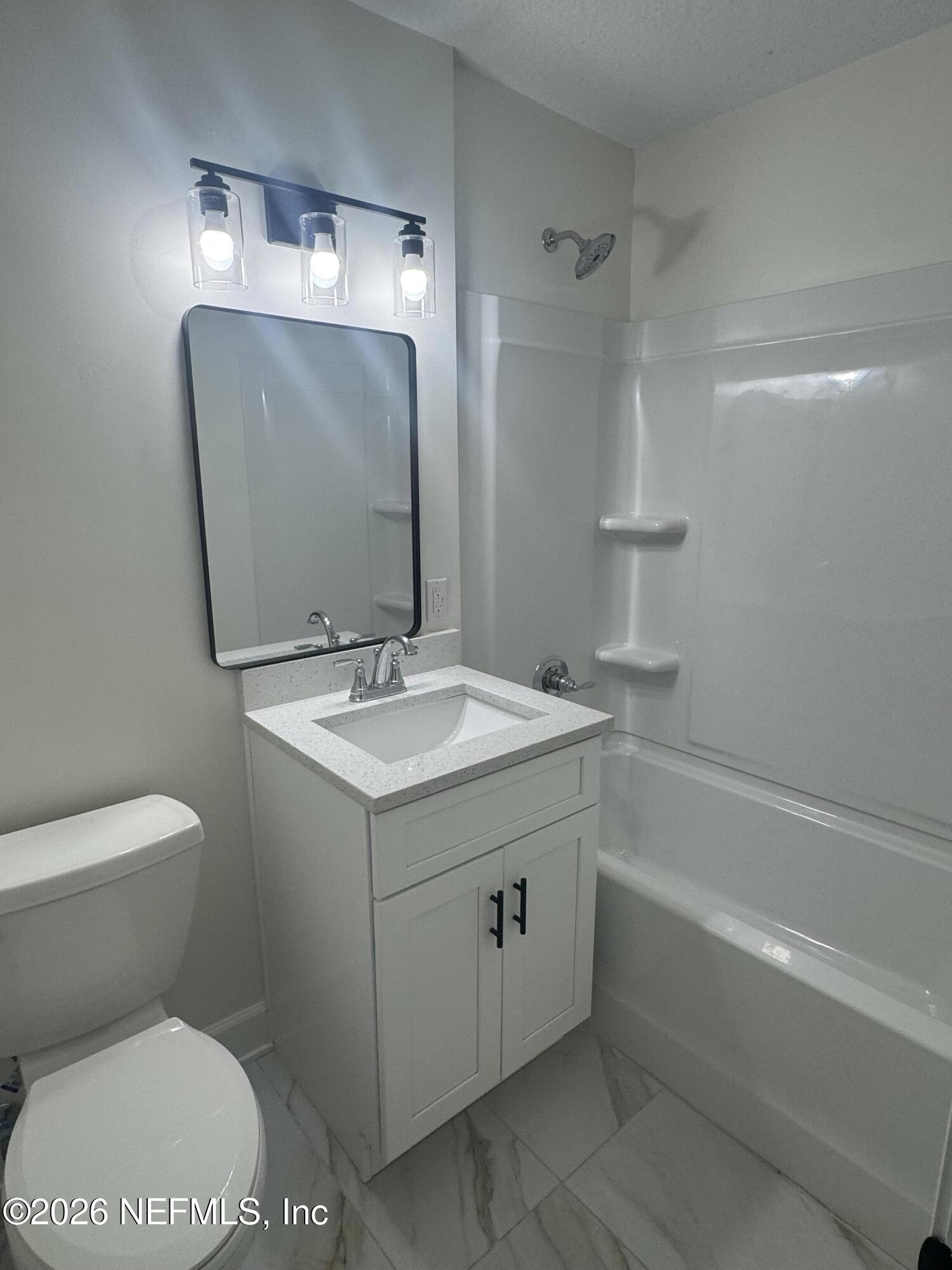 5202 Southwest 155th Street Starke, FL 32091 - Photo 13 of 13 a bathroom with a sink toilet and shower