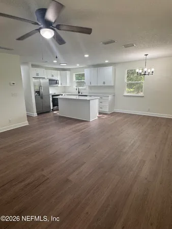 a view of kitchen with wooden floor