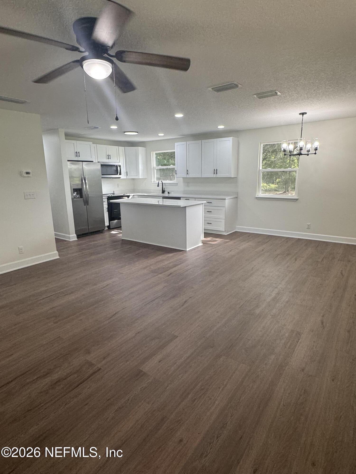 5202 Southwest 155th Street Starke, FL 32091 - Photo 5 of 13 a view of kitchen with wooden floor